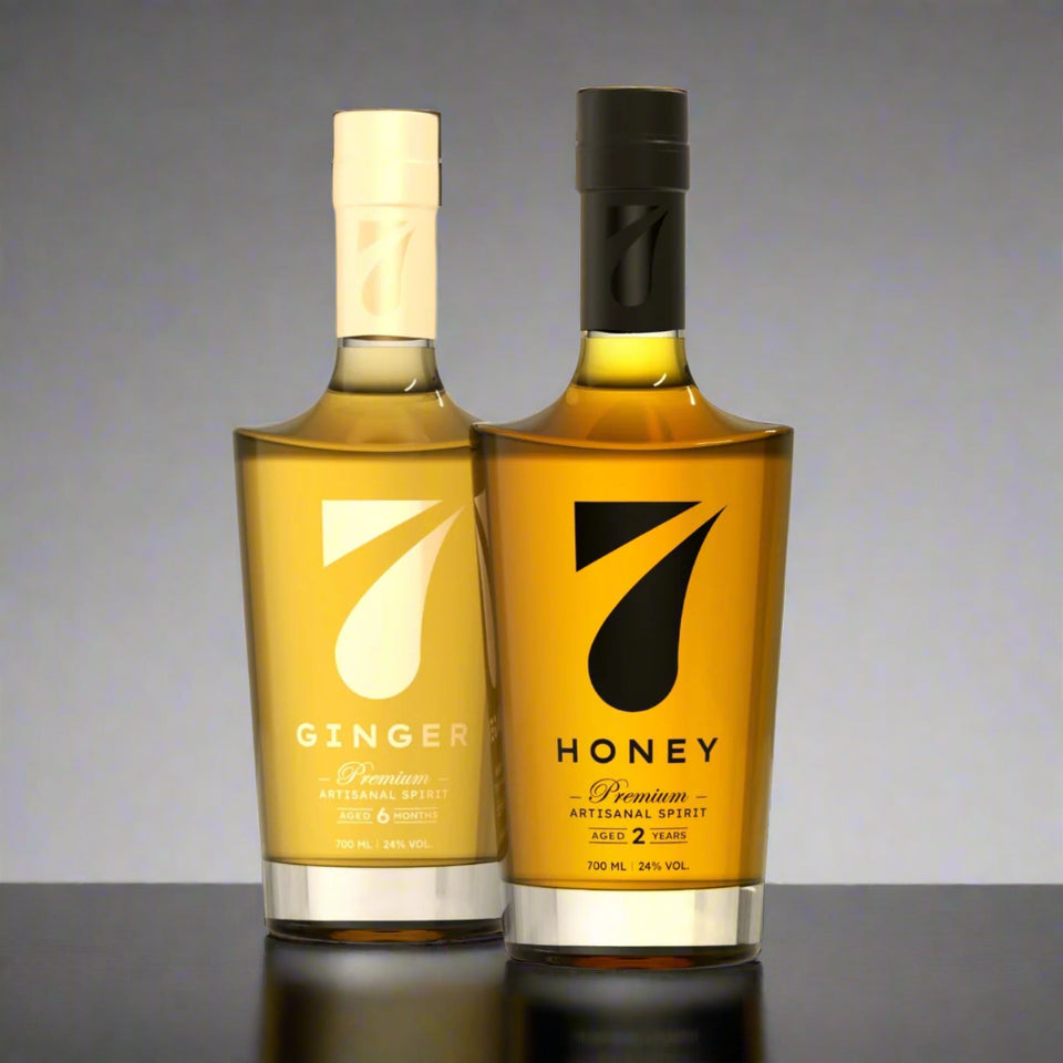 Two bottles of 7 Ginger and 7 Honey on a beige background